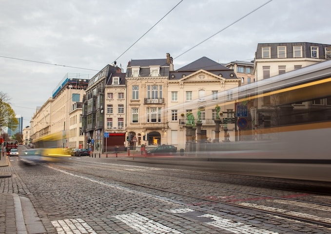 Tramway in motion on the street of Brussels near The Sablon Square