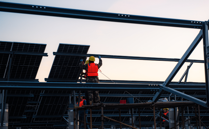 Workers install solar panels in Hebei province, China.